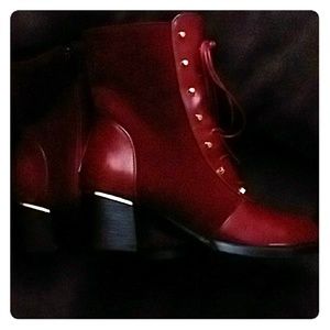 Red boots with lace up gold trim